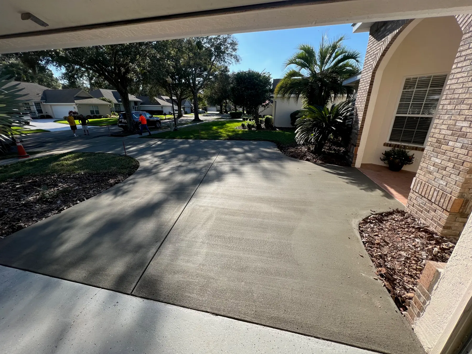 New concrete in front of a garage, seen from inside the garage.