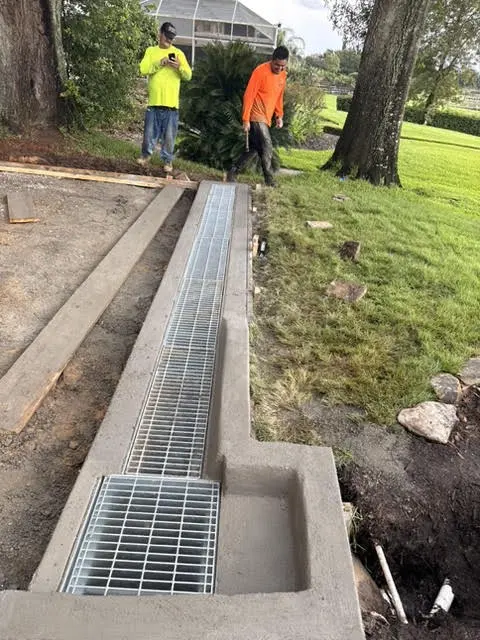 A channel drain formed in new concrete.